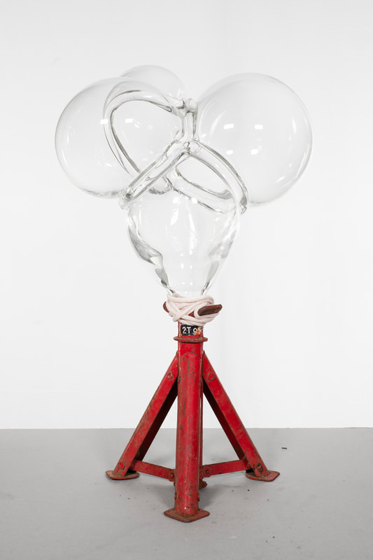 inhale embrace II, 68 x 44 x 46 cm ca, hand blown glass volume, recovered vintage steel axle stand element, cotton rope, 2025 