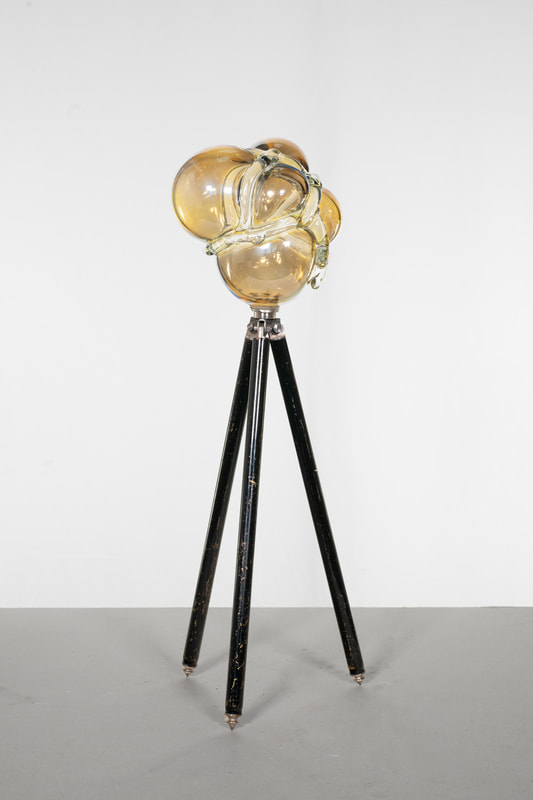Syrens outlook II, hand blown glass volume, repurposed metal tripod, 140x18x44 cm ca, 2024 